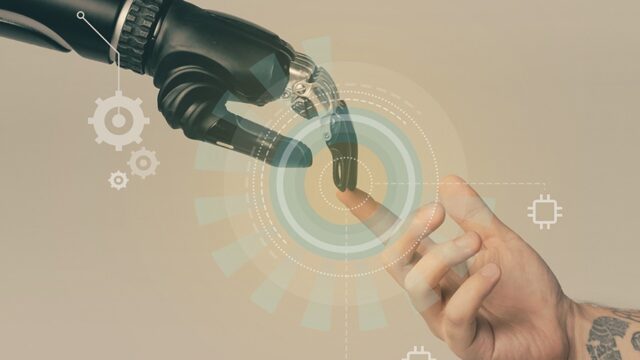 A robotic hand touching a human hand